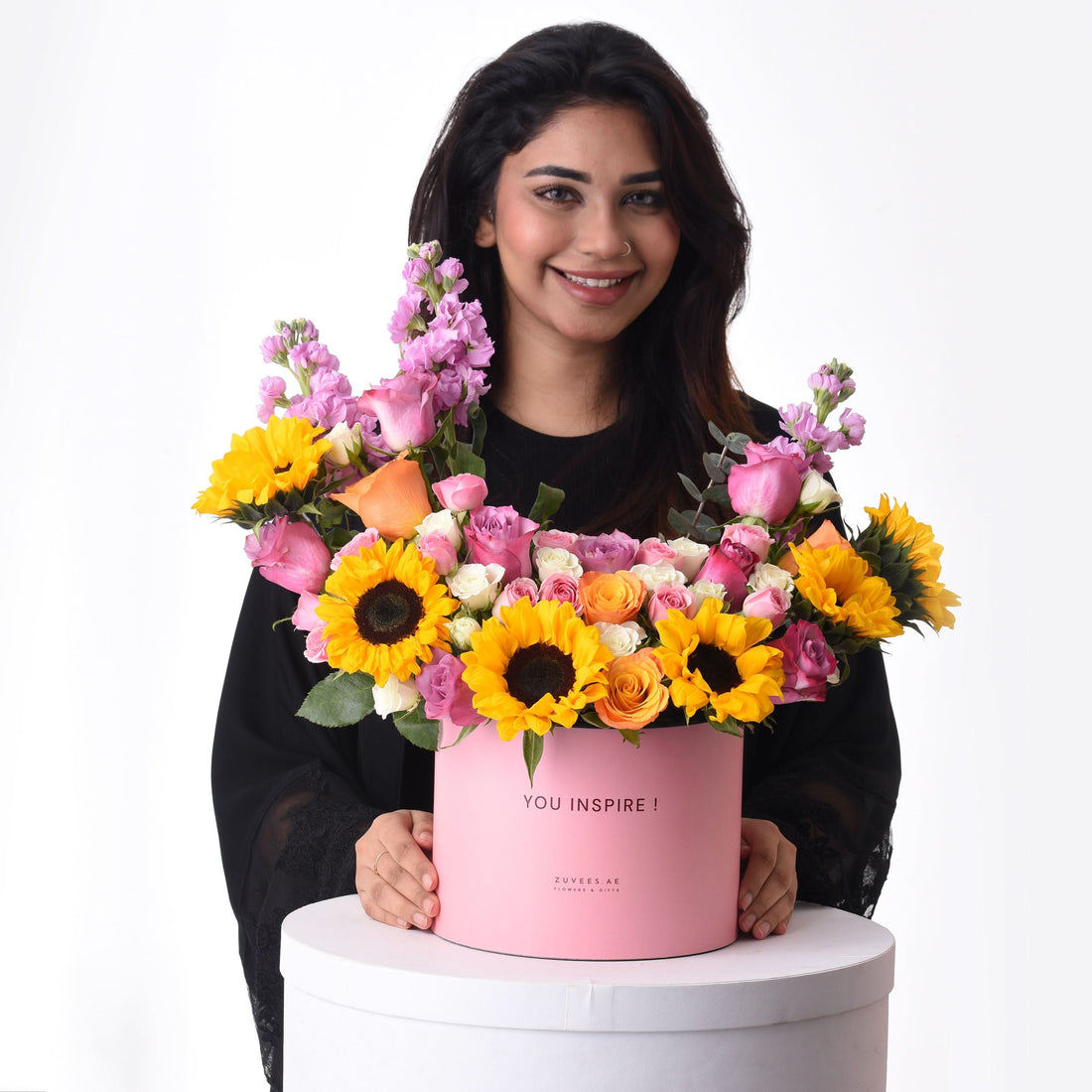 Pink box holds vibrant sunflowers, roses, and snapdragons—“YOU INSPIRE!” message.