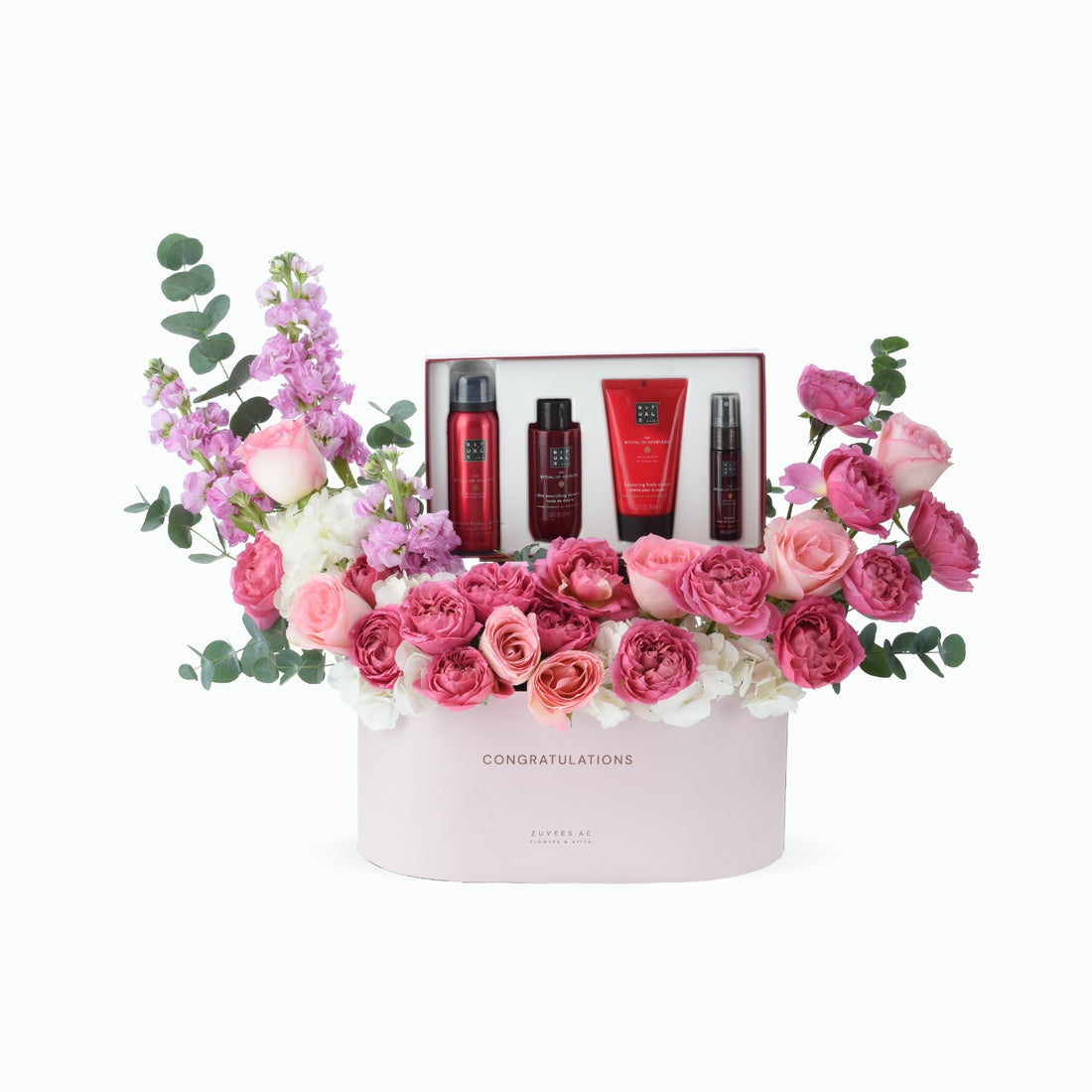 Pink floral arrangement with luxury skincare set, "Congratulations" gift box.