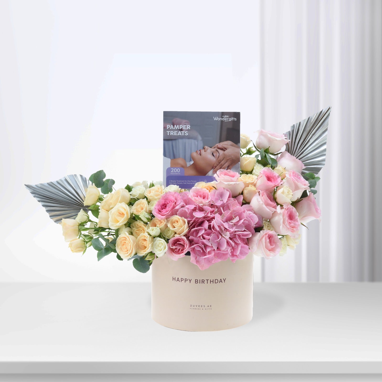 Pastel pink and cream roses with hydrangeas, silver fan accents, and "Happy Birthday" box.