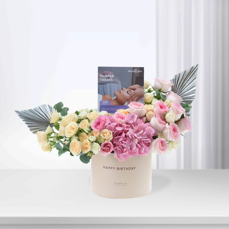 Pastel pink and cream roses with hydrangeas, silver fan accents, and "Happy Birthday" box.