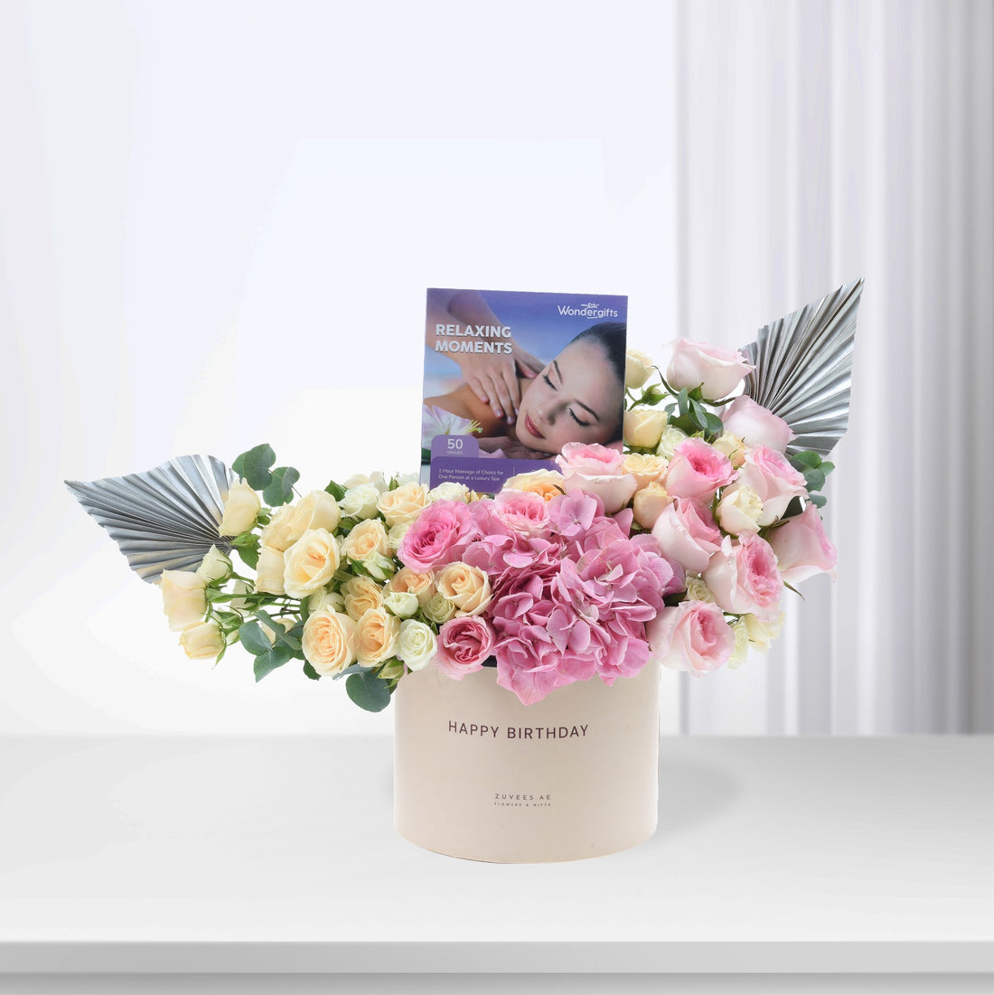 Soft pink and cream roses with hydrangeas, silver accents, and "Happy Birthday" box.