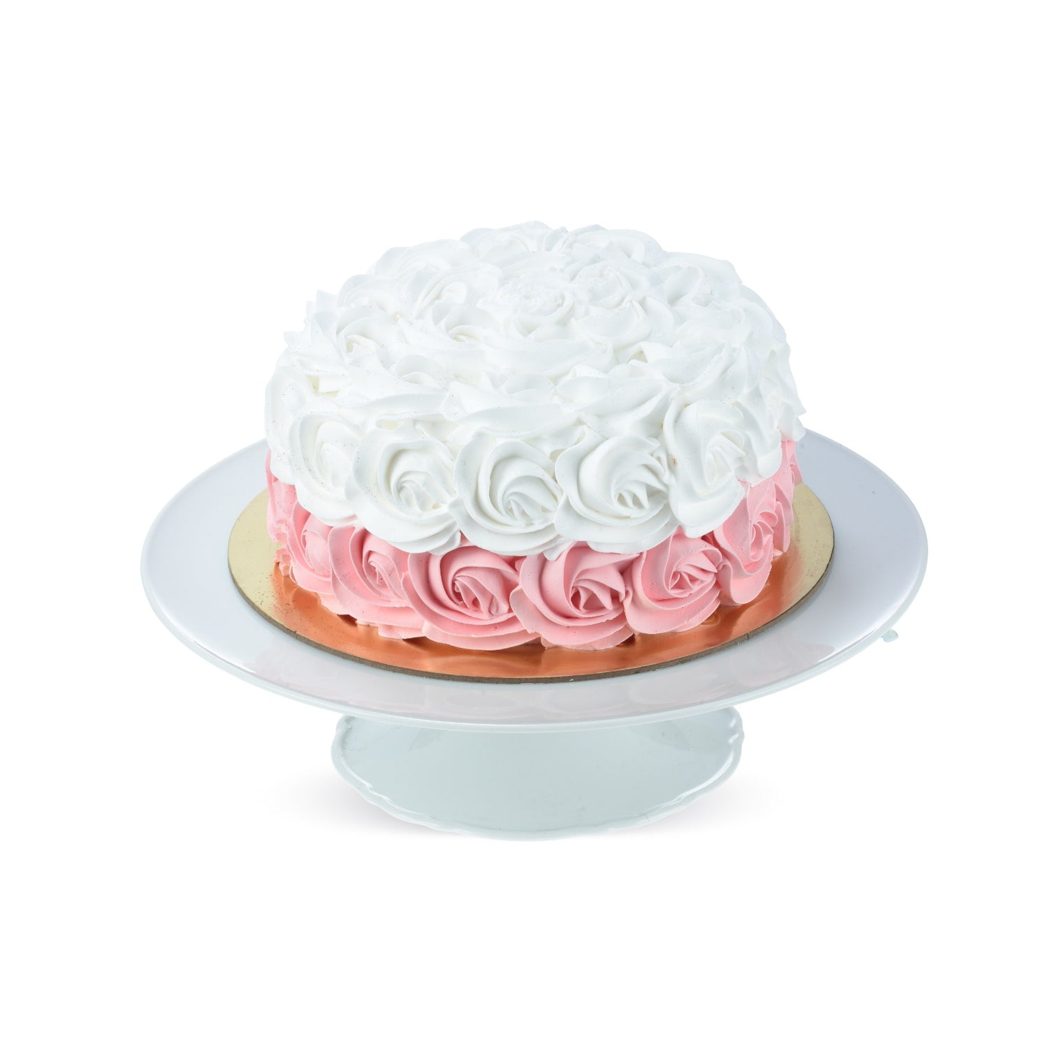 White and pink rose-patterned cake on elegant cake stand.