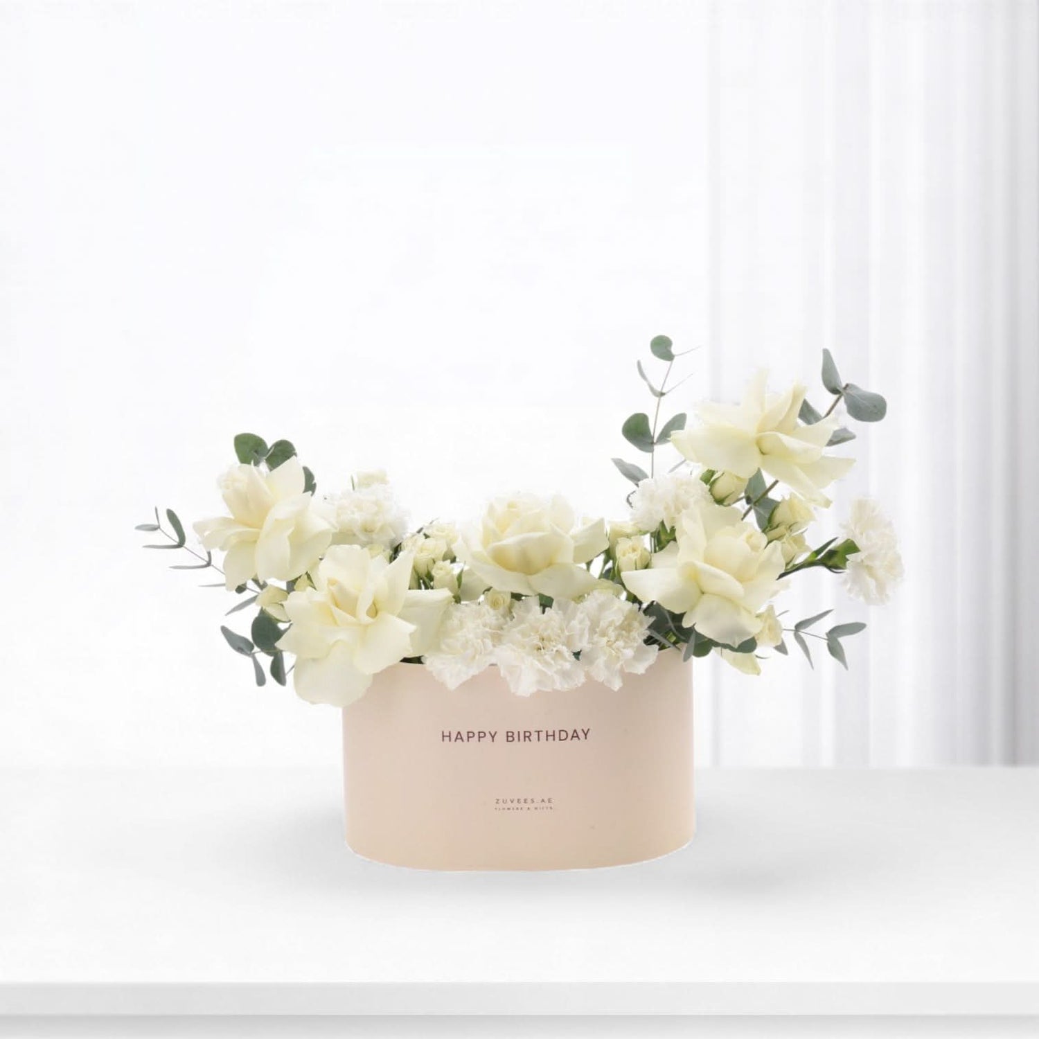 Elegant white roses, carnations, eucalyptus in blush "Happy Birthday" box, minimalist chic.
