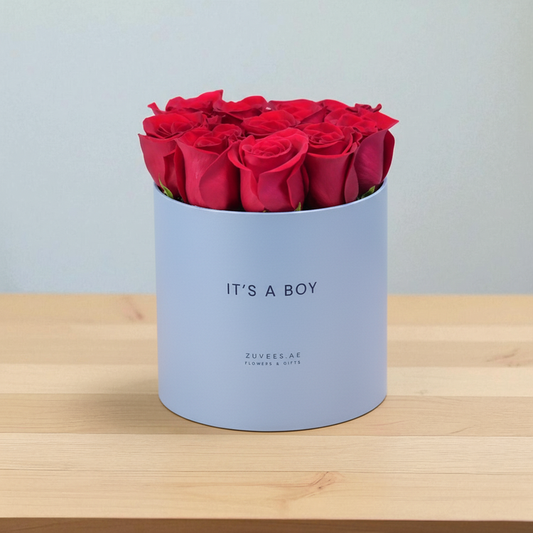 Vibrant red roses fill light blue "It&