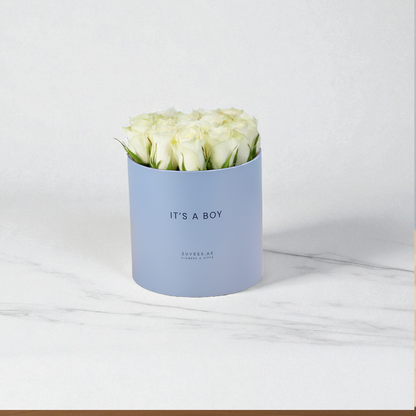 Soft blue box holds creamy white roses, "IT&
