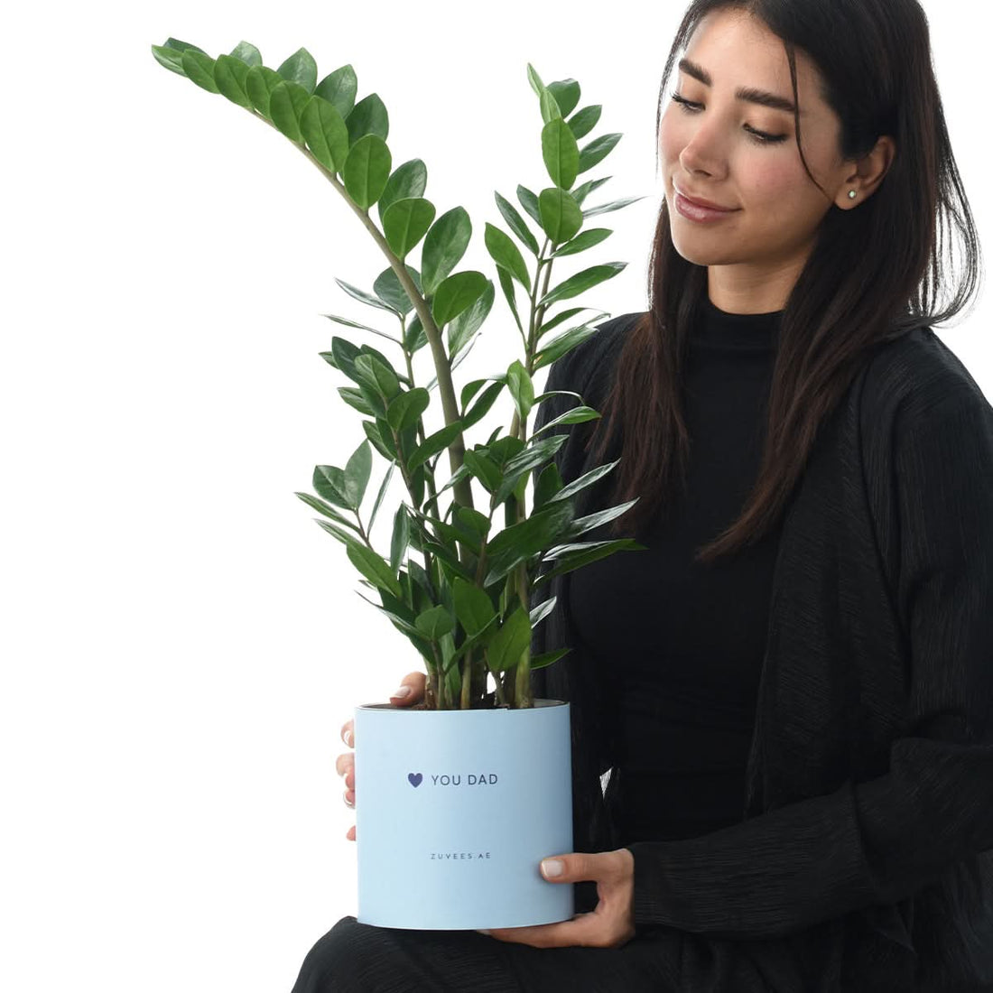 Woman holding a Zamiifolia ZZ plant in a Love You Dad vase, Father&