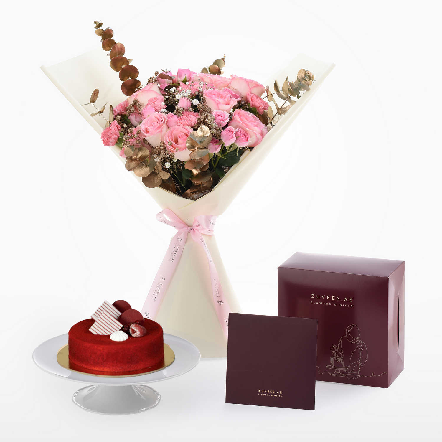 Pink roses and hydrangeas elegantly wrapped, paired with a red velvet cake and branded gift box.