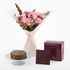 Pink roses and eucalyptus bouquet with chocolate cake, elegant burgundy gift box.