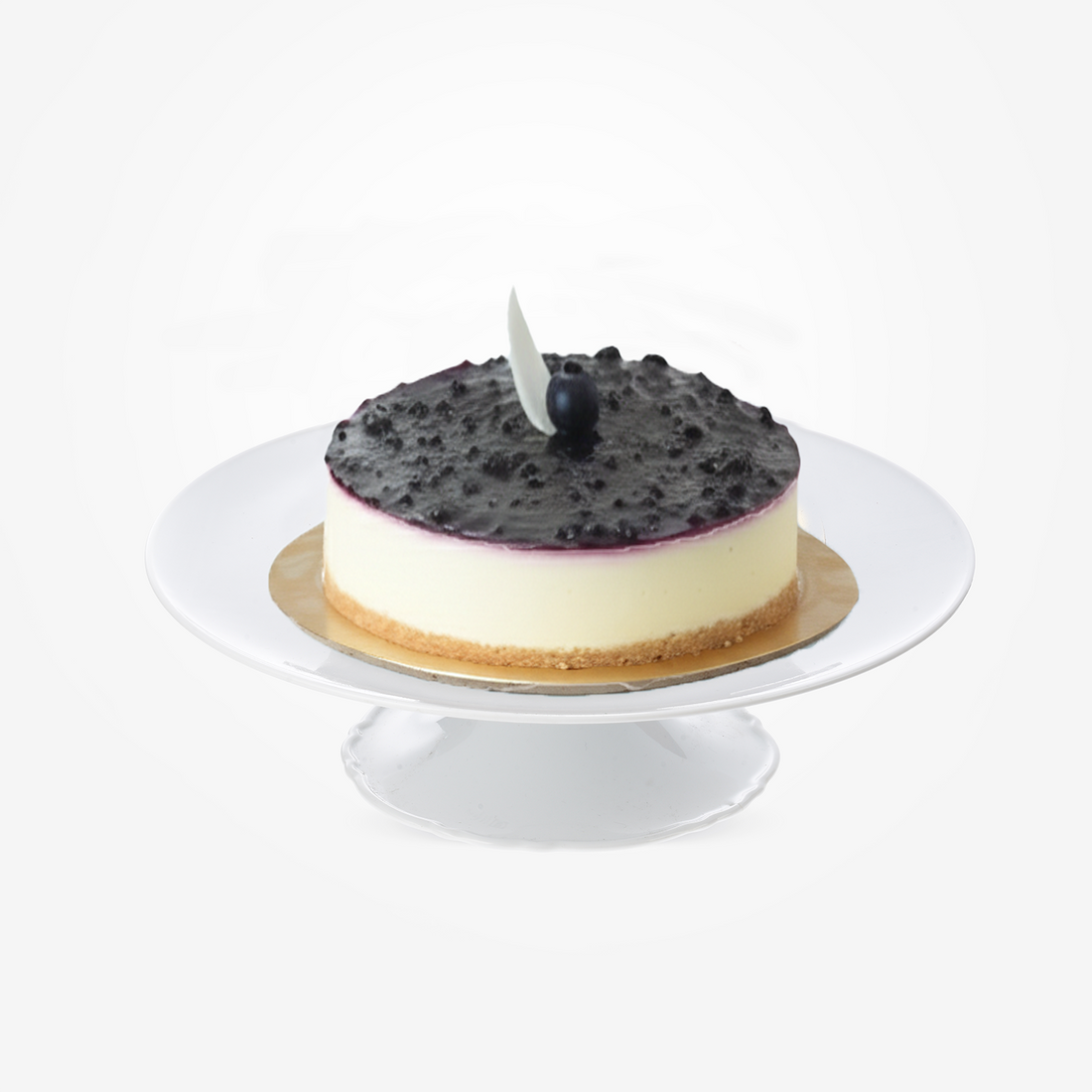 Creamy cheesecake topped with blueberry sauce, single blueberry, and white leaf garnish.