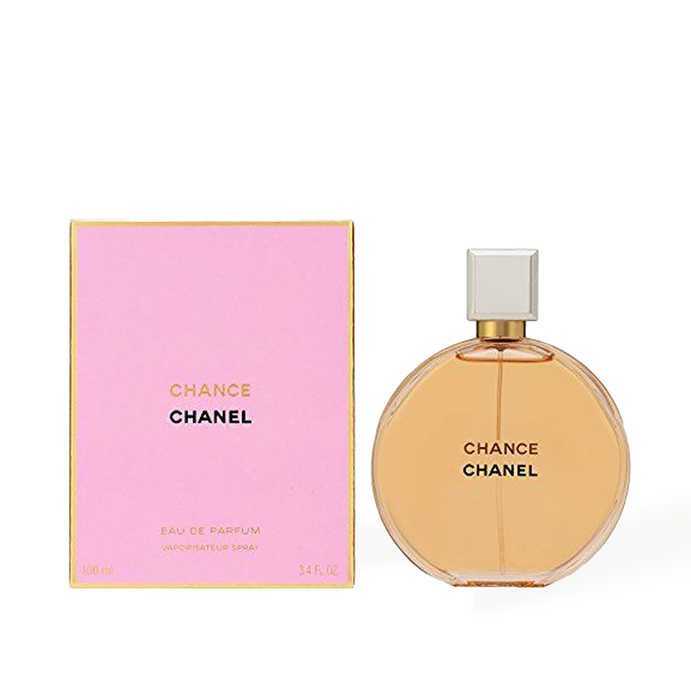 Pink Chanel Chance perfume bottle beside matching box, gold accents, amber liquid.