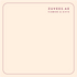 Soft blush square with maroon border, “ZUVEES.AE Flowers & Gifts” text top right.