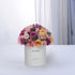 Pastel pink, purple, and peach roses in white box reading "I&