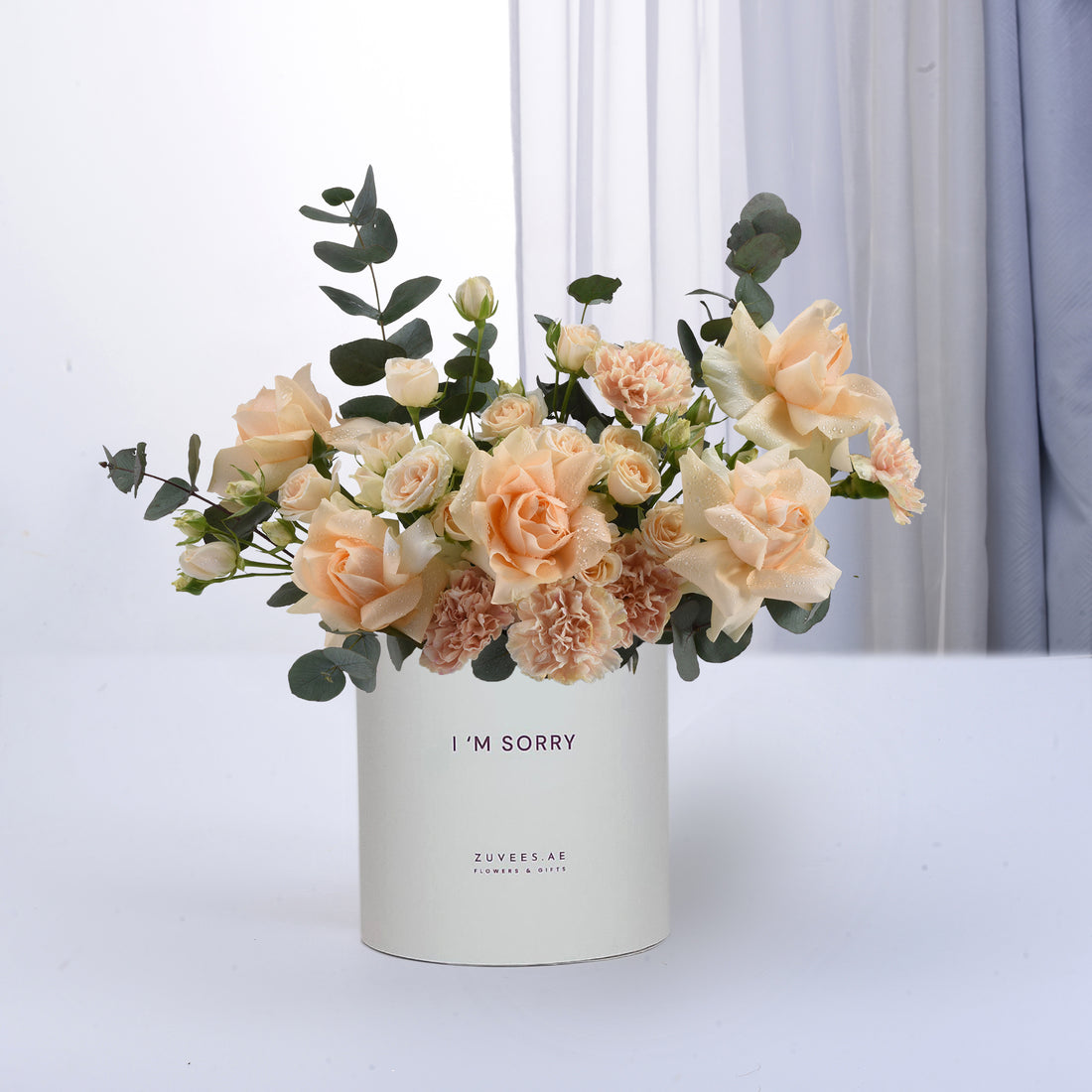 Soft peach roses, carnations, eucalyptus in white "I&