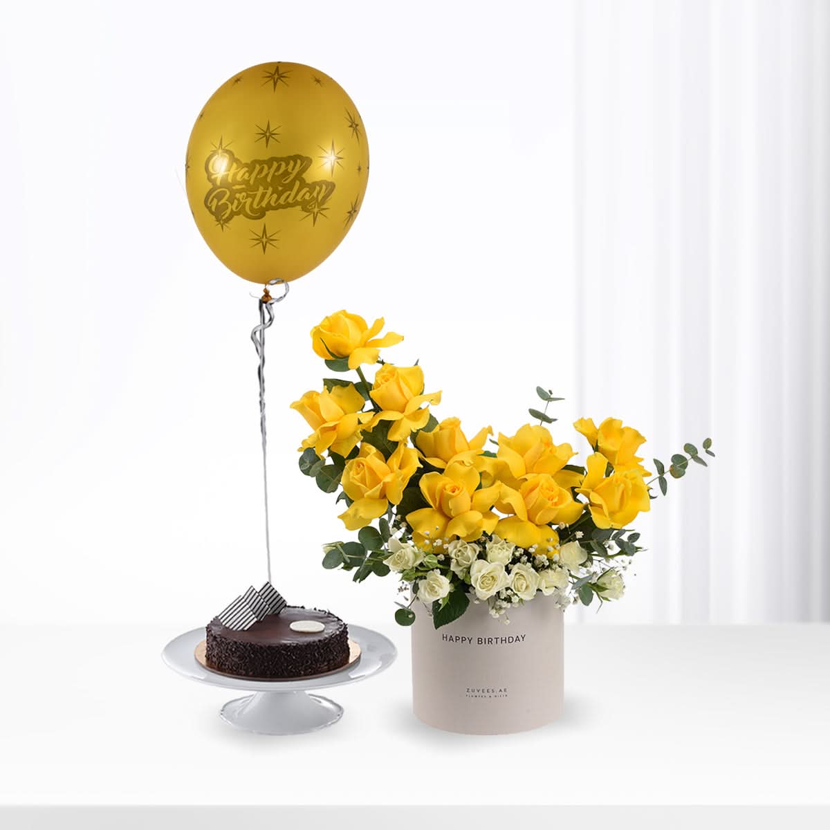 Golden balloon, yellow roses, chocolate cake — birthday celebration bundle.