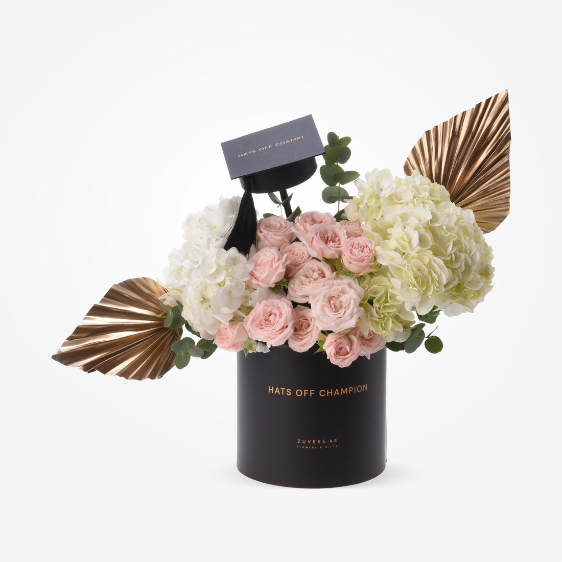 Elegant black graduation-themed floral arrangement with pink roses, white hydrangeas, and gold accents.
