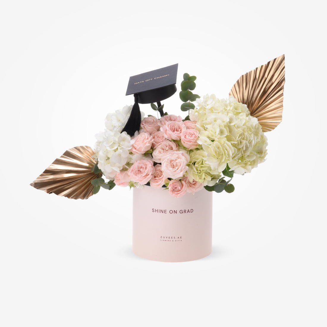 Pink roses, white hydrangeas, gold leaves, black grad cap in blush "Shine On Grad" box.