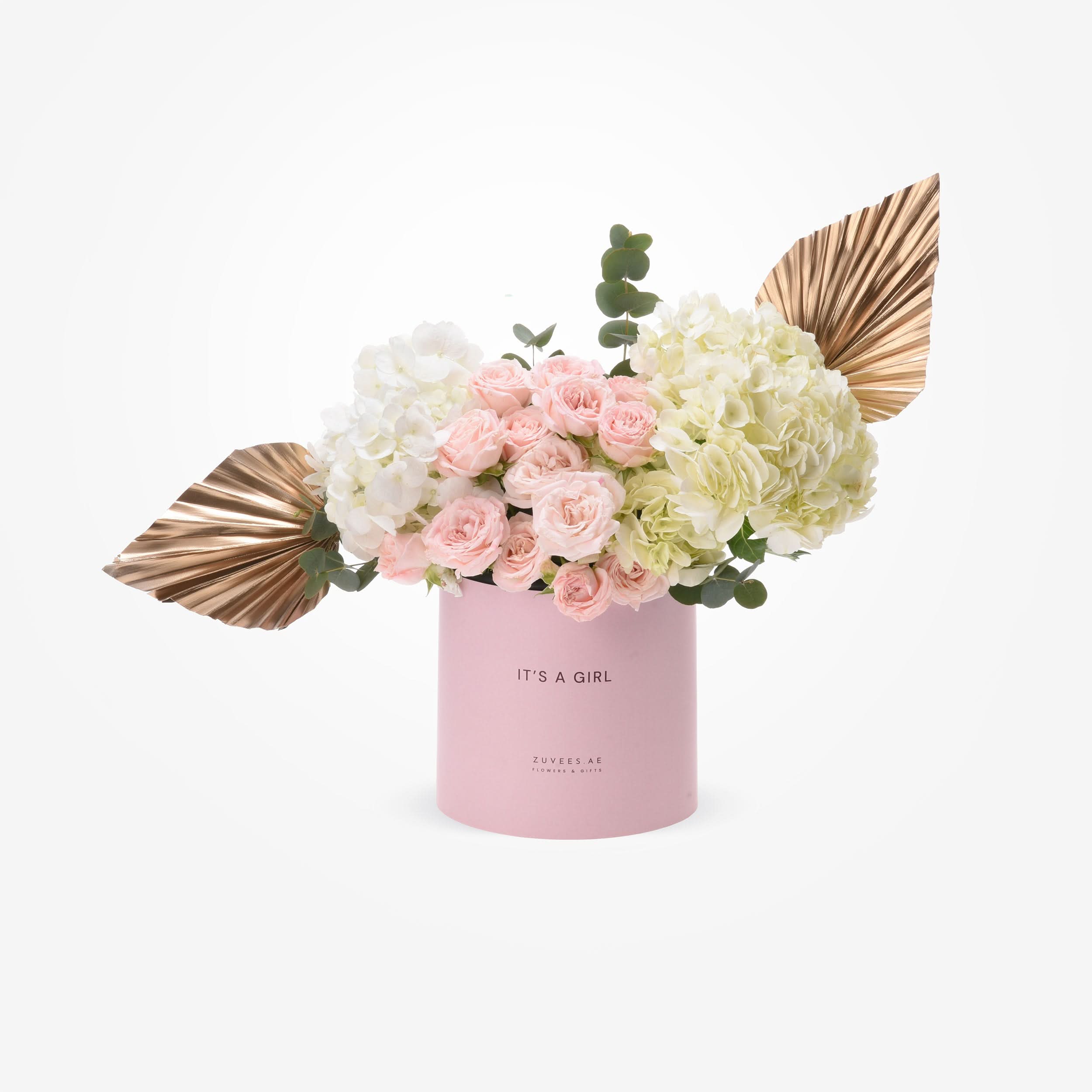 Soft pink roses and hydrangeas in blush box with gold leaf accents.