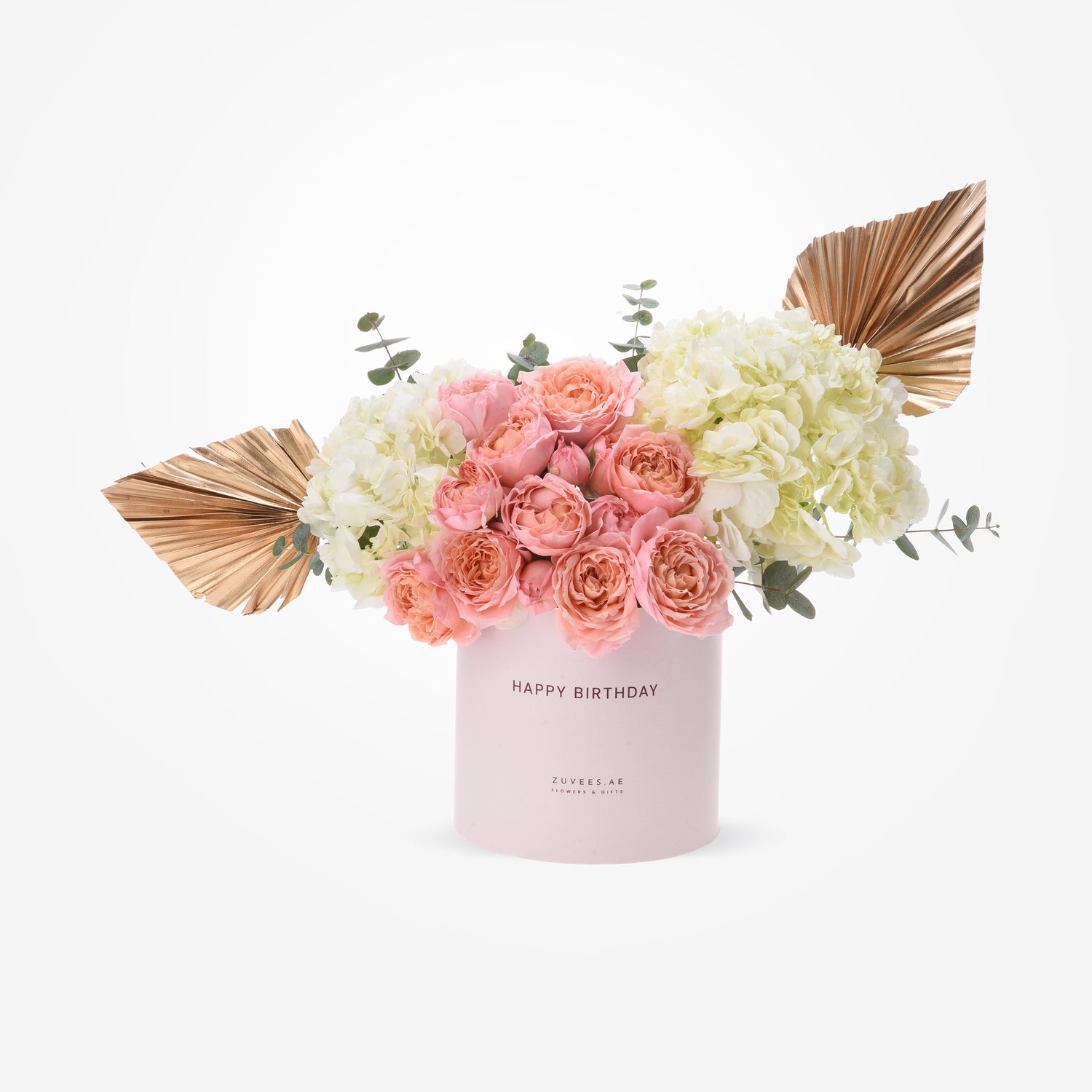 Pink roses and hydrangeas in pastel box with gold fan accents.