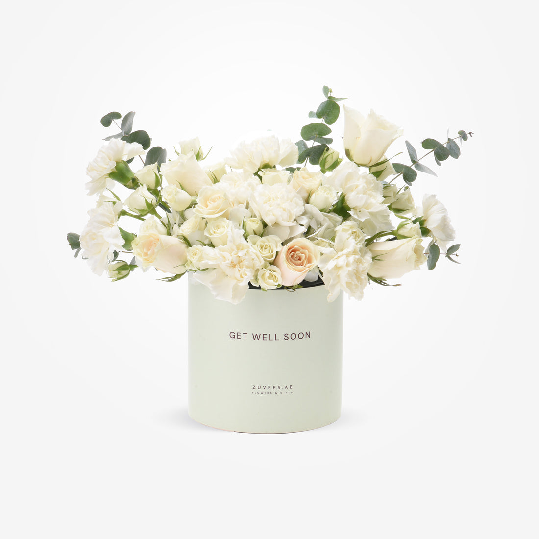 Soft white roses and eucalyptus in mint "Get Well Soon" cylinder.