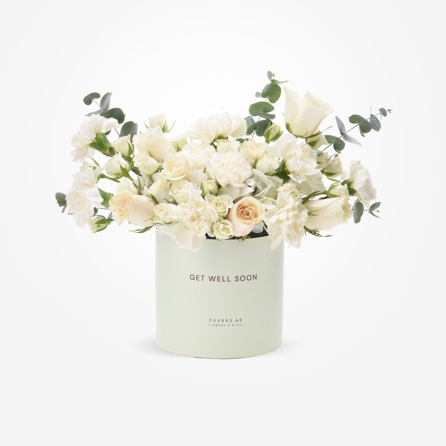 Soft white roses and eucalyptus in mint "Get Well Soon" cylinder.
