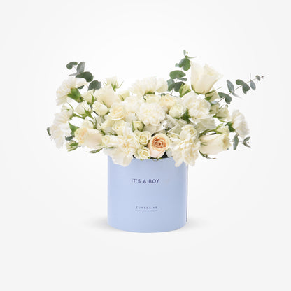 Elegant white roses and carnations in a soft blue "It&