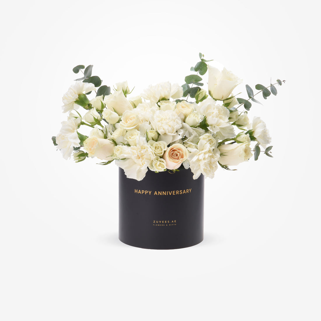 Elegant white roses and eucalyptus in black box with gold "Happy Anniversary" text.