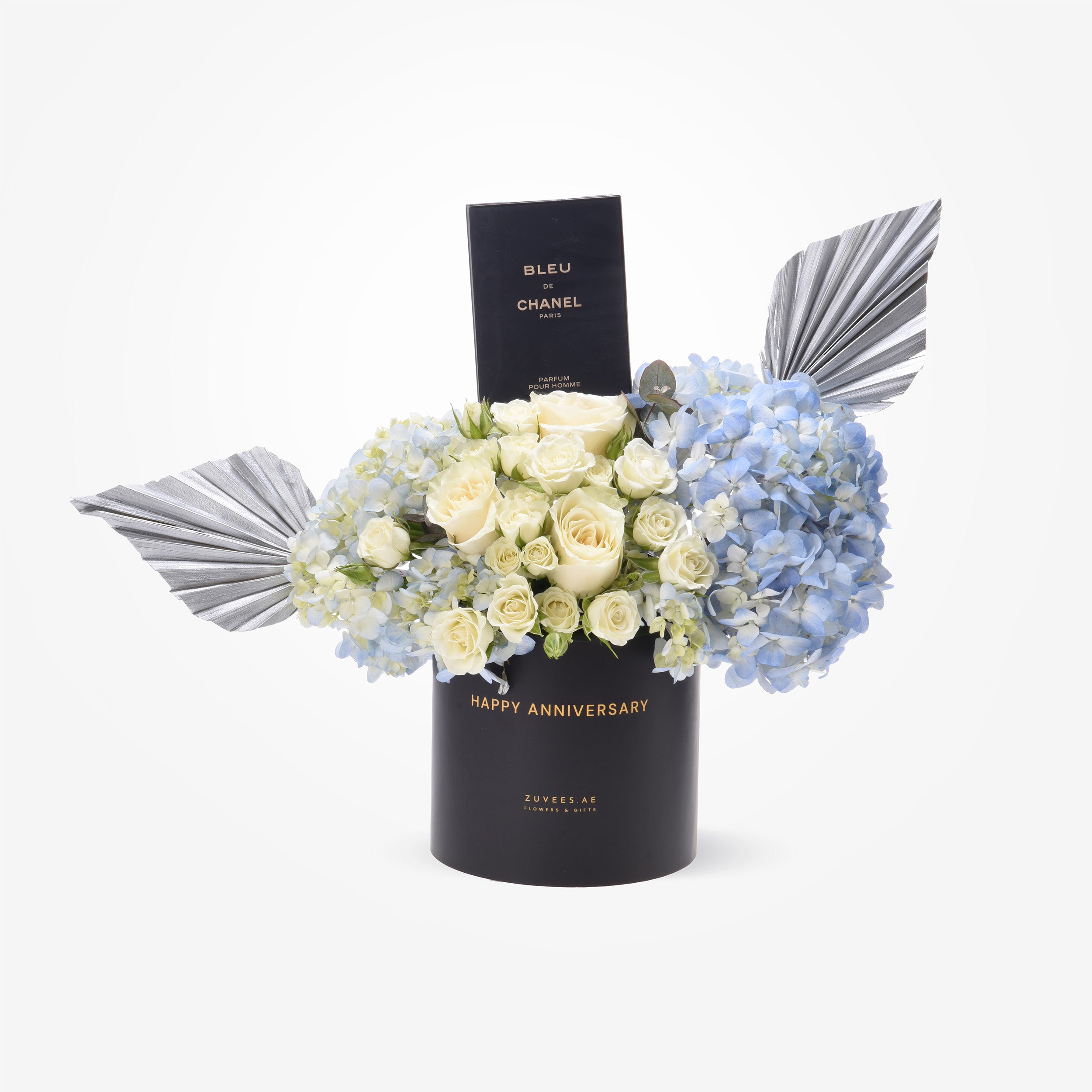 Elegant black anniversary gift box with white roses, blue hydrangeas, and silver fan accents.