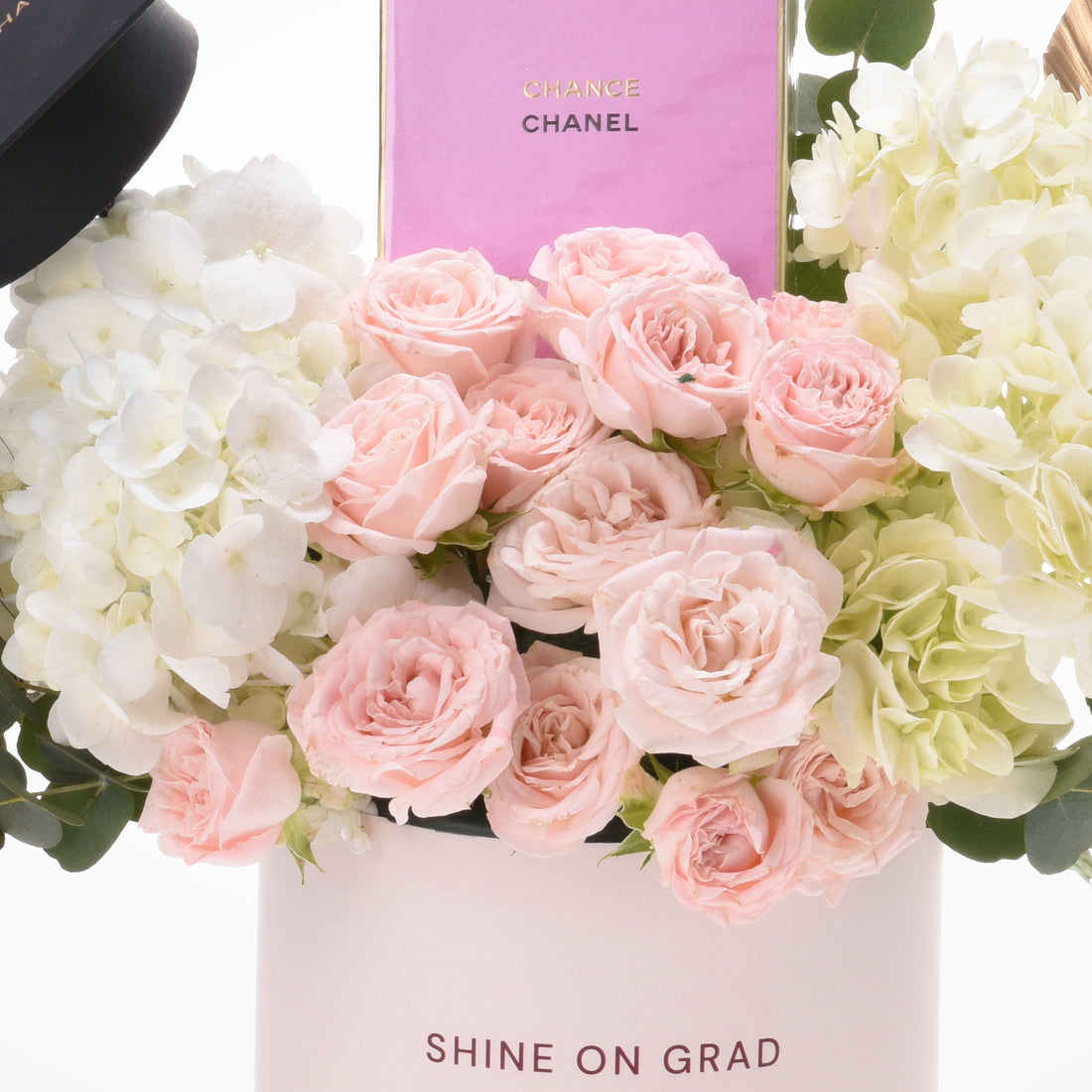 Pink roses and hydrangeas in a "Shine On Grad" box with Chanel Chance perfume.