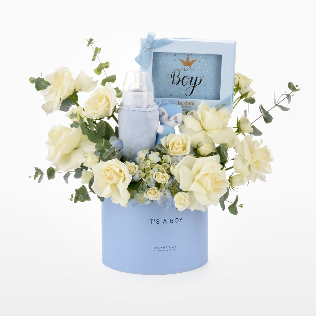 Soft blue baby-themed gift basket with creamy roses and plush toy.