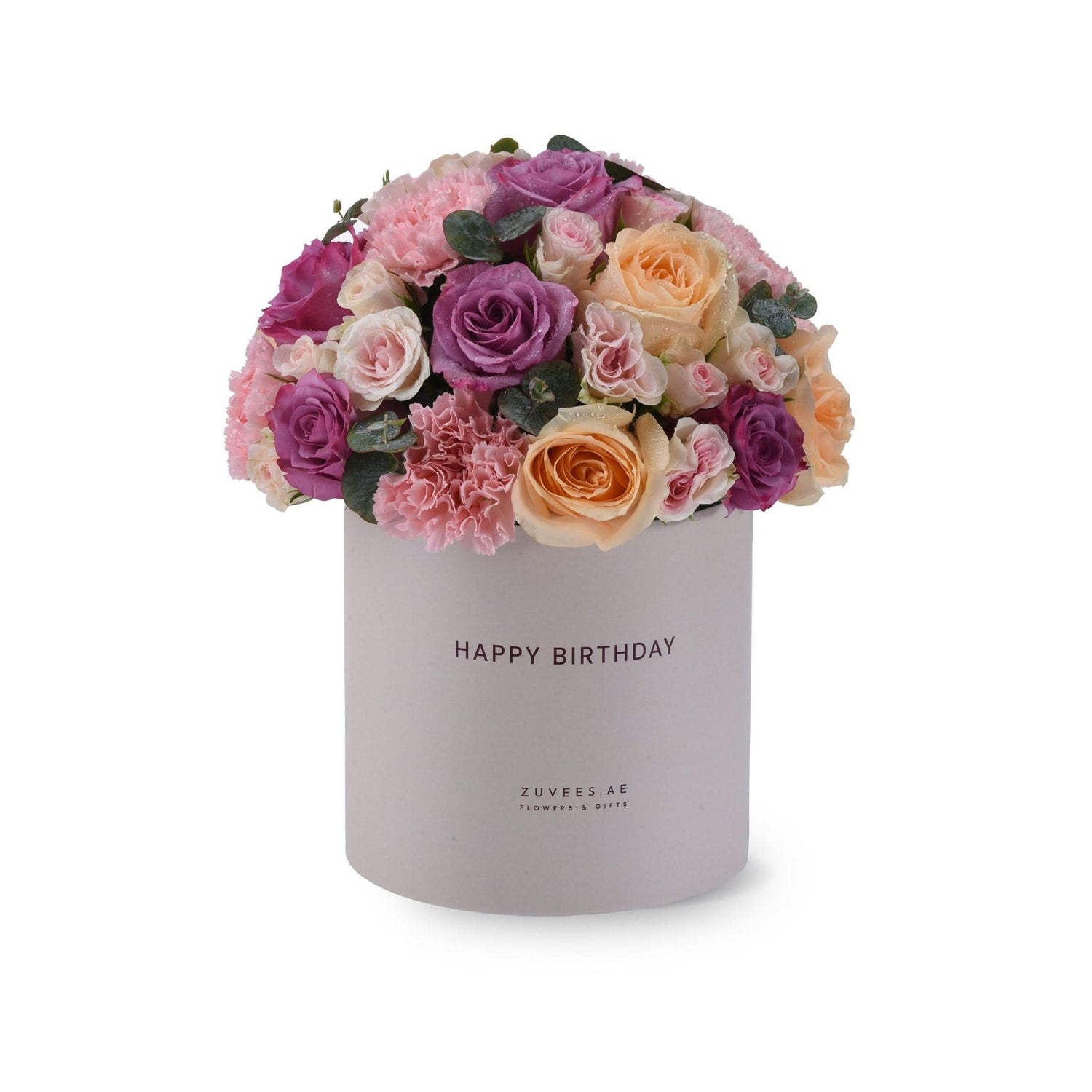 Pastel pink, purple, and peach roses in a lavender box with "Happy Birthday" text.