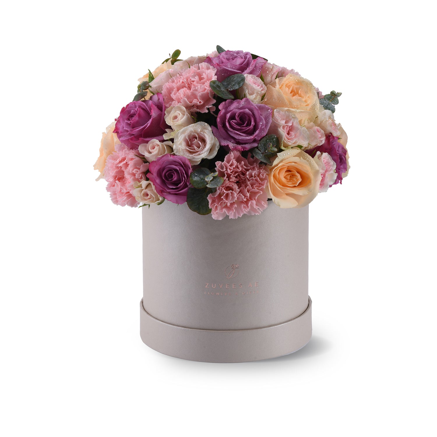 Elegant pastel roses and carnations in a matte silver hatbox.