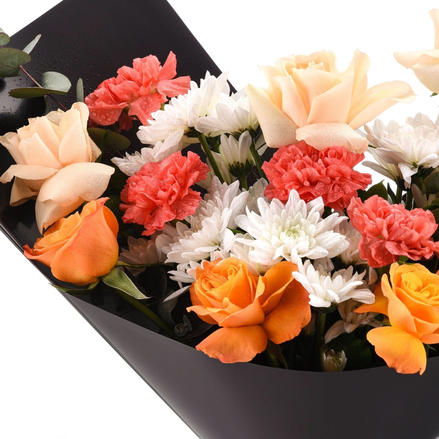 Vibrant orange, peach, and coral blooms with dewdrops, elegantly wrapped in matte black paper.