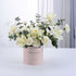 Elegant white roses and carnations in a pink "Congratulations" cylinder gift box.