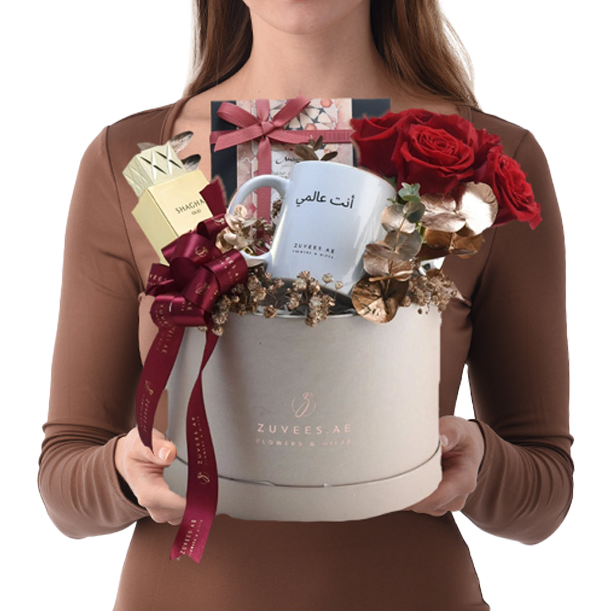 Elegant white gift box with red roses, gold accents, and personalized mug.