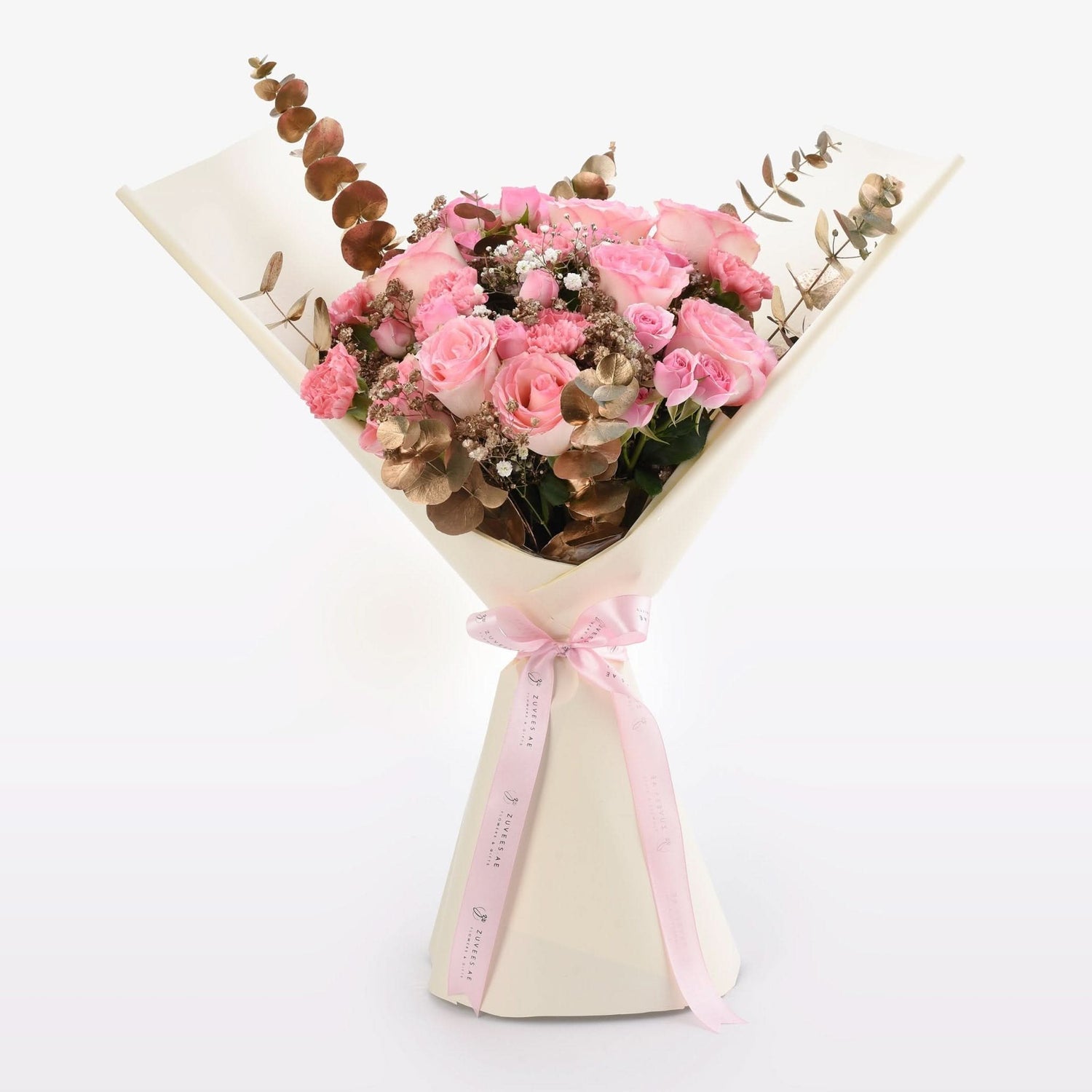 Soft pink roses, eucalyptus, and baby’s breath in cream wrap with pink ribbon.