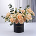 Elegant peach roses and carnations in black "Happy Anniversary" cylinder vase.