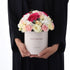 Elegant pink, white, and yellow floral arrangement in a "Happy Birthday" box.
