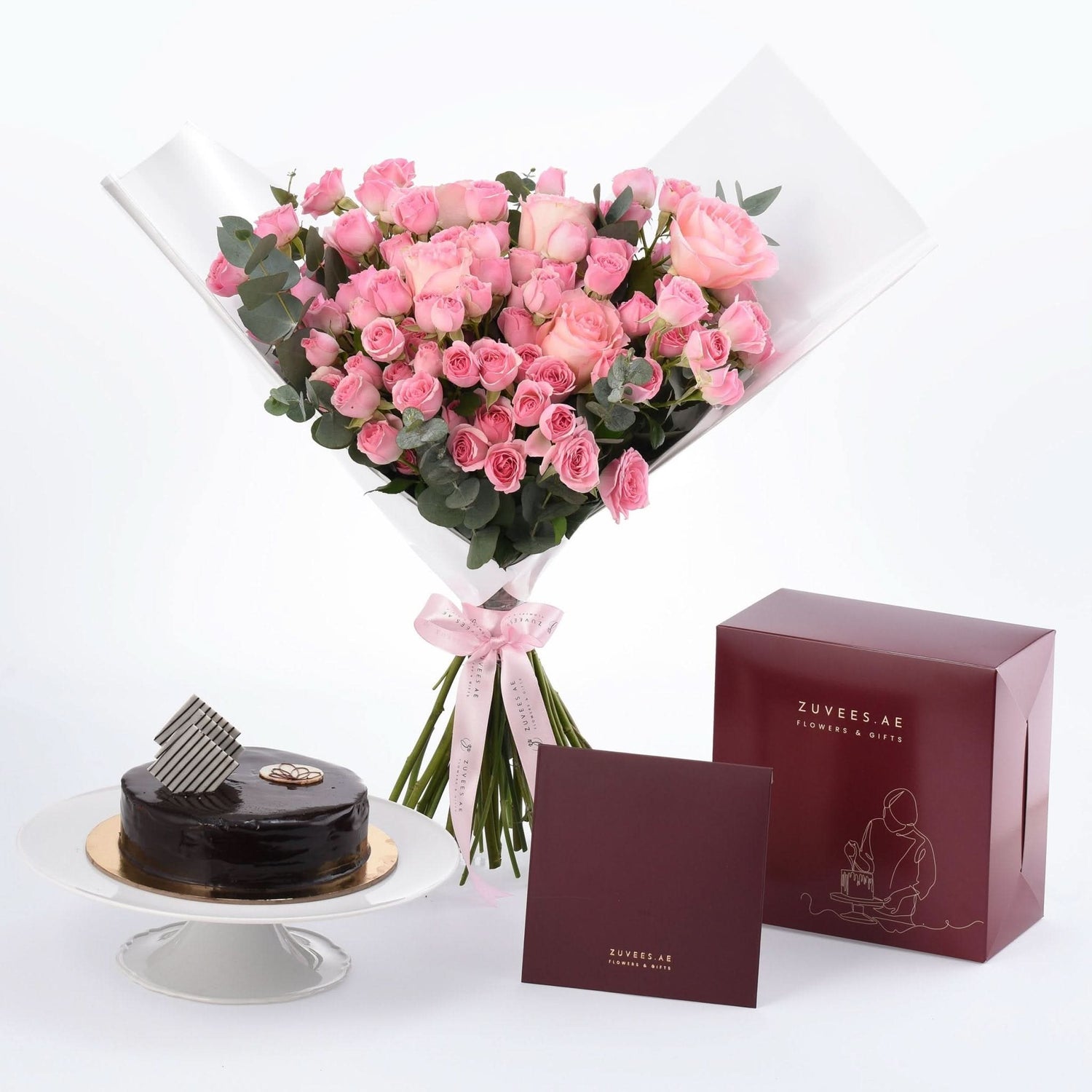 Pink roses bouquet with chocolate cake and ZUVEES.AE gift box.