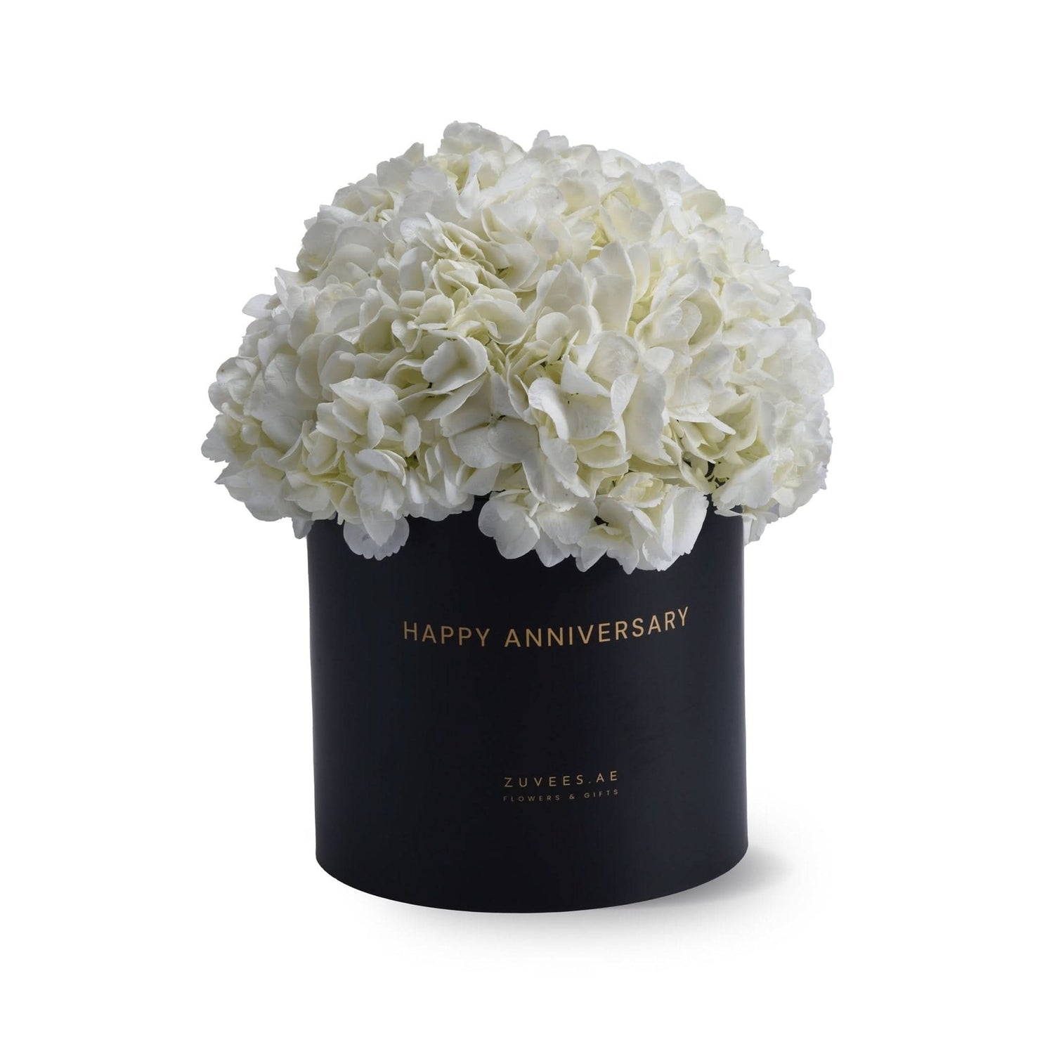 Elegant white hydrangeas in black "Happy Anniversary" gift box, gold lettering, minimalist luxury floral arrangement.
