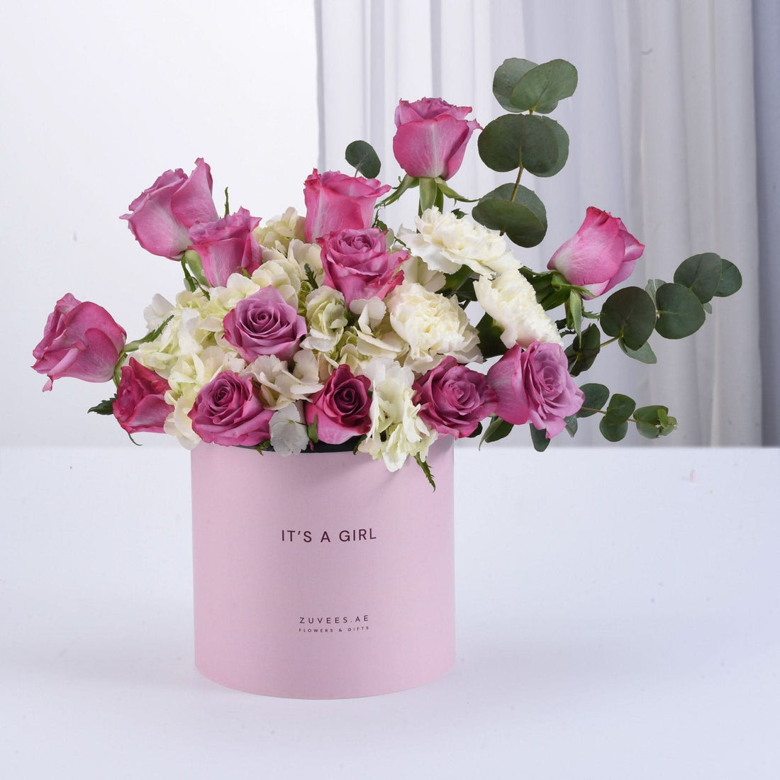 Pink rose bouquet in soft pink box reading "It&