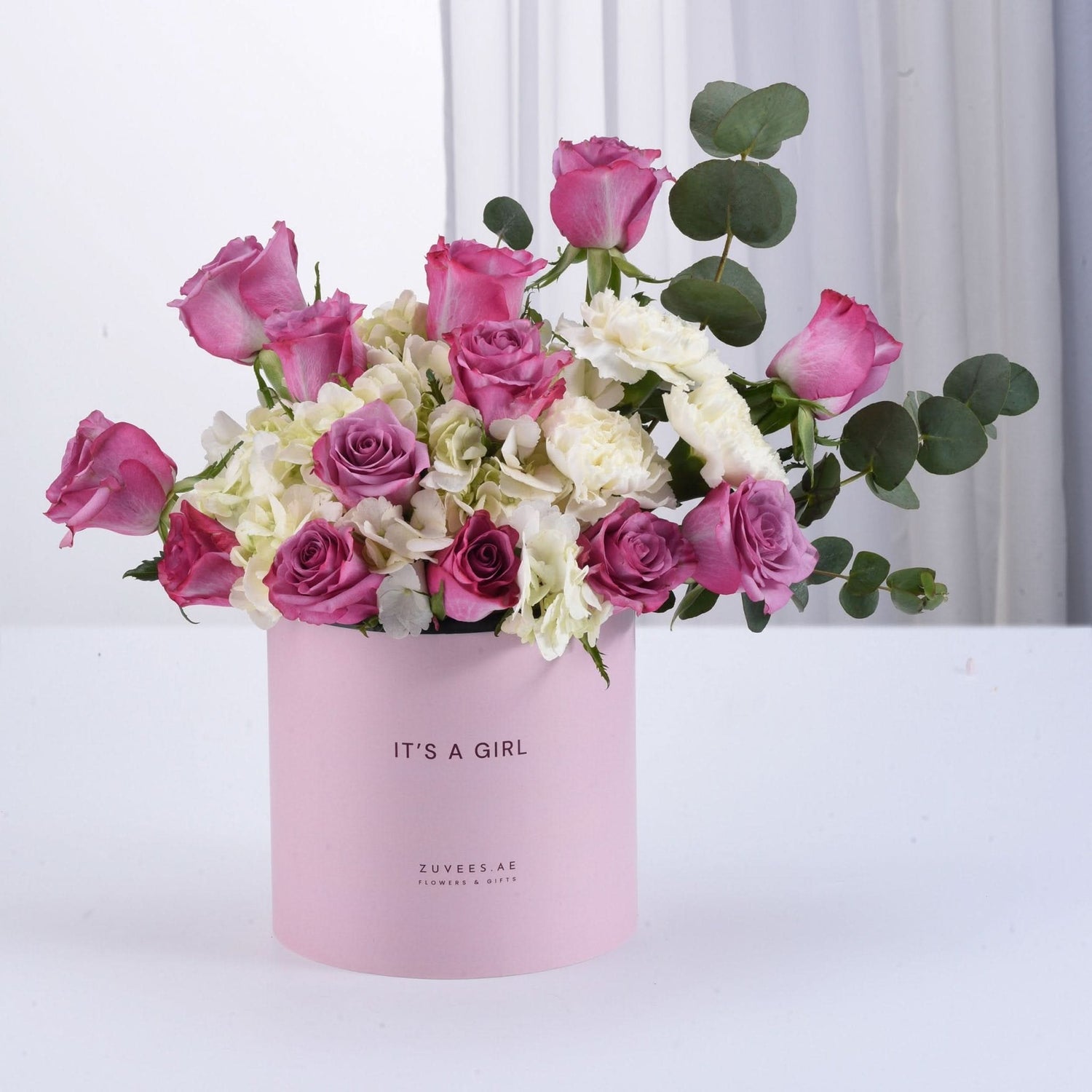 Pink rose bouquet in soft pink box reading "It&