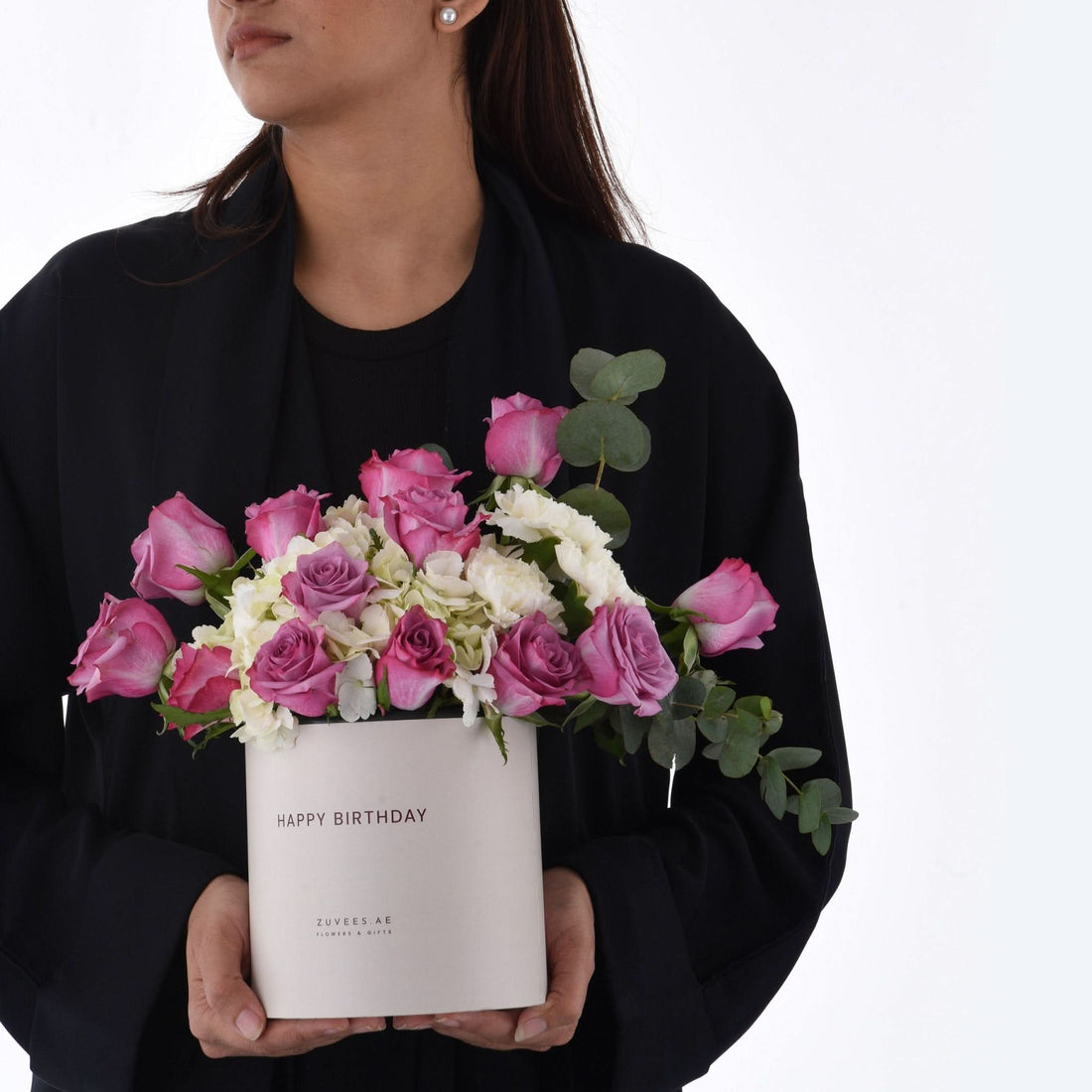 Elegant pink roses and white blooms in a "Happy Birthday" box.