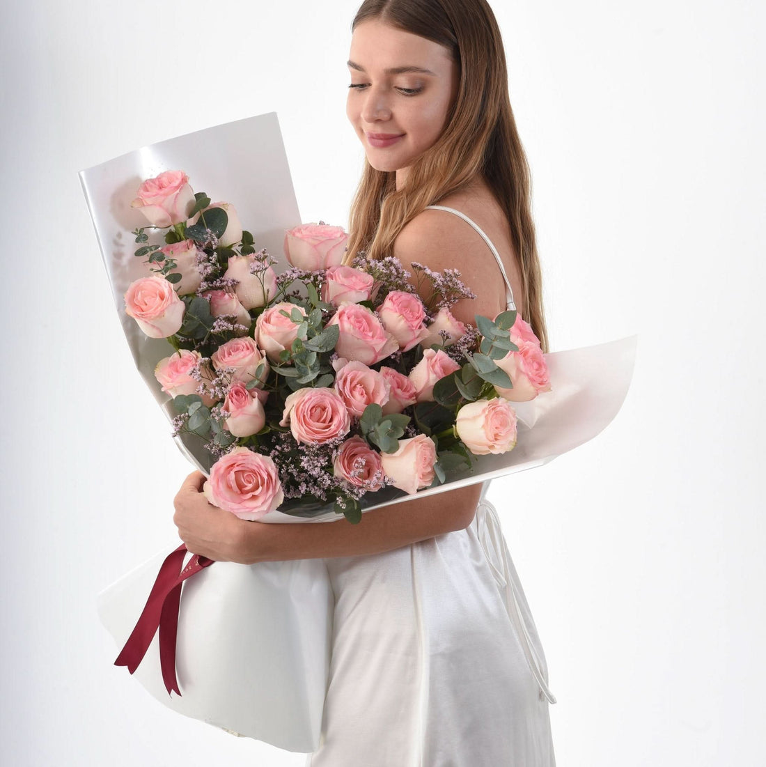 Soft pink roses, eucalyptus, and baby&