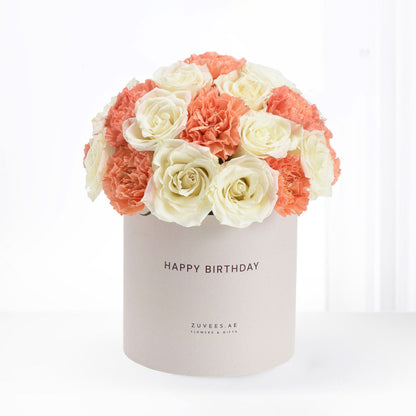 Cream roses, coral carnations in elegant beige "Happy Birthday" box, perfect gift.