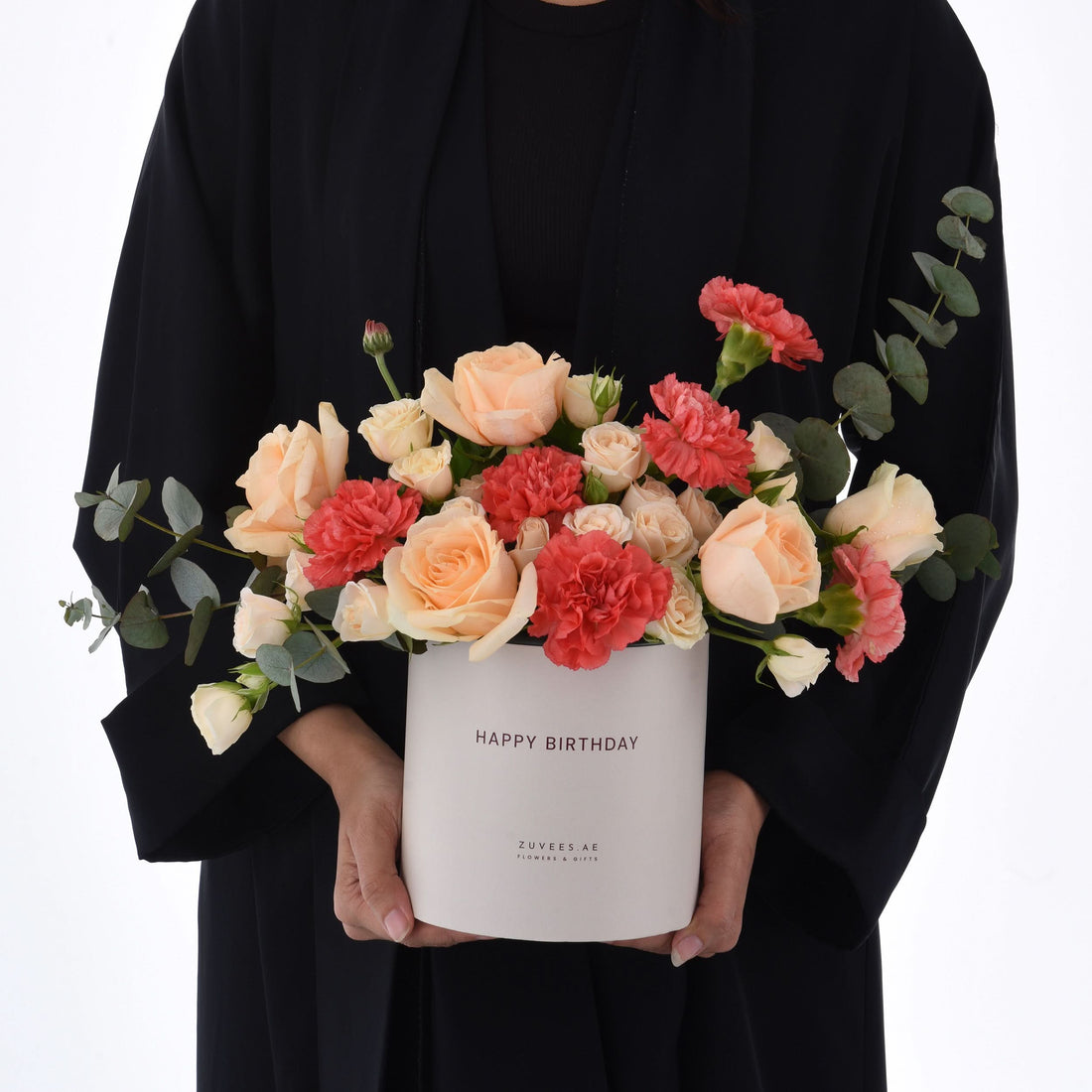 White box holds peach roses and red carnations, "Happy Birthday" printed.