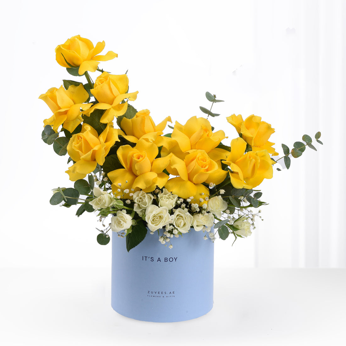 Vibrant yellow roses and white blooms in light blue "It&