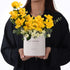 Vibrant yellow roses and white blooms in minimalist box with "Happy Birthday" text.