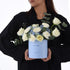 Light blue box holds white roses and hydrangeas, “It’s a Boy” gift.