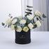 Elegant white roses and blue hydrangeas in matte black box.