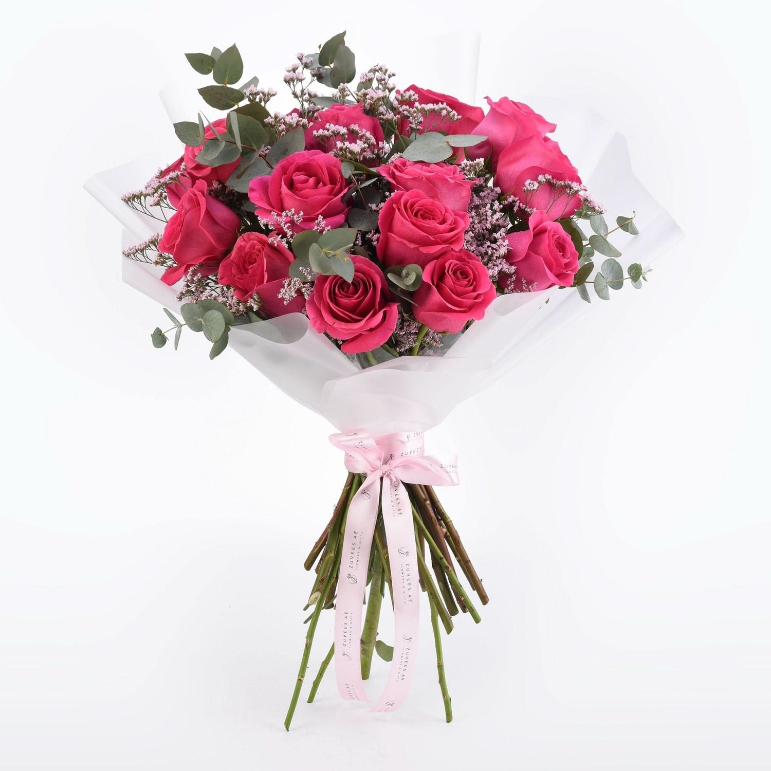 Vibrant pink roses, eucalyptus, and baby&